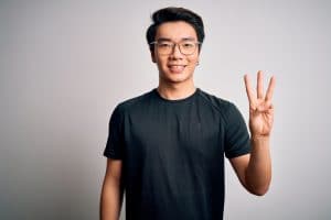 man showing three fingers