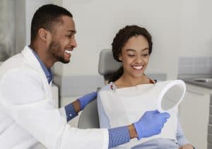 young woman happy about the appearance of her restored smile